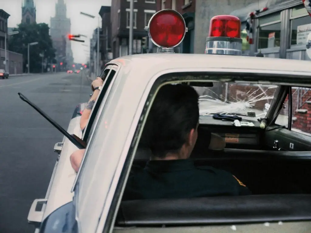 Bud Lee - Far Out Magazine - Newark police patrol car
