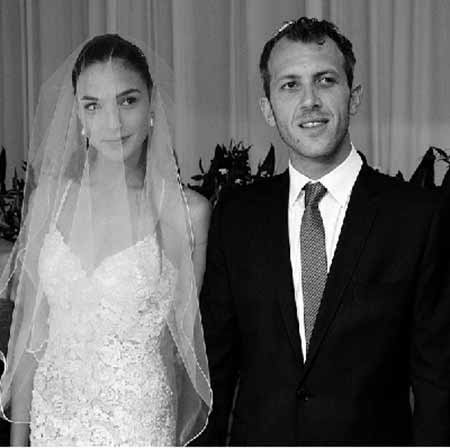   Gal Gadot's wedding photo in which she is seen in fitted lace gown and Versano in a classic black suit