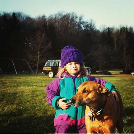   Al Pacino's daughter Julie Marie Pacino's childhood photo with her pet dog in a ground