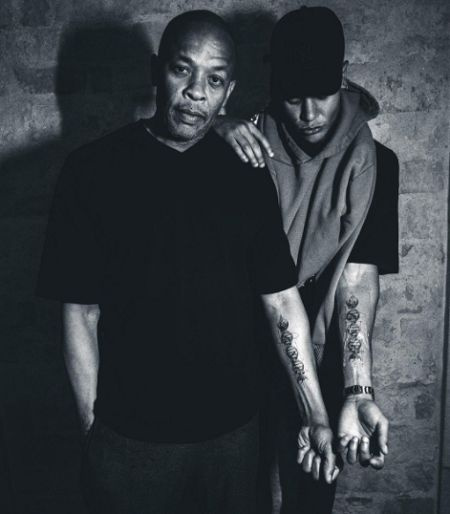 Dr A.S. Dre et son fils Truice's matching tattoo.