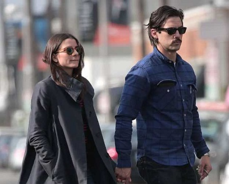Milo Ventimiglia's girlfriend Kelly Egarian walking together taking hand in hand.